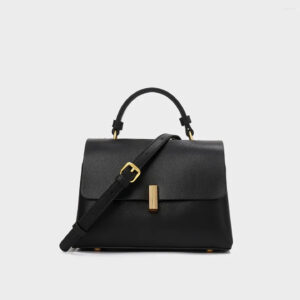 Black vegan leather crossbody purse with gold-tone hardware and adjustable strap