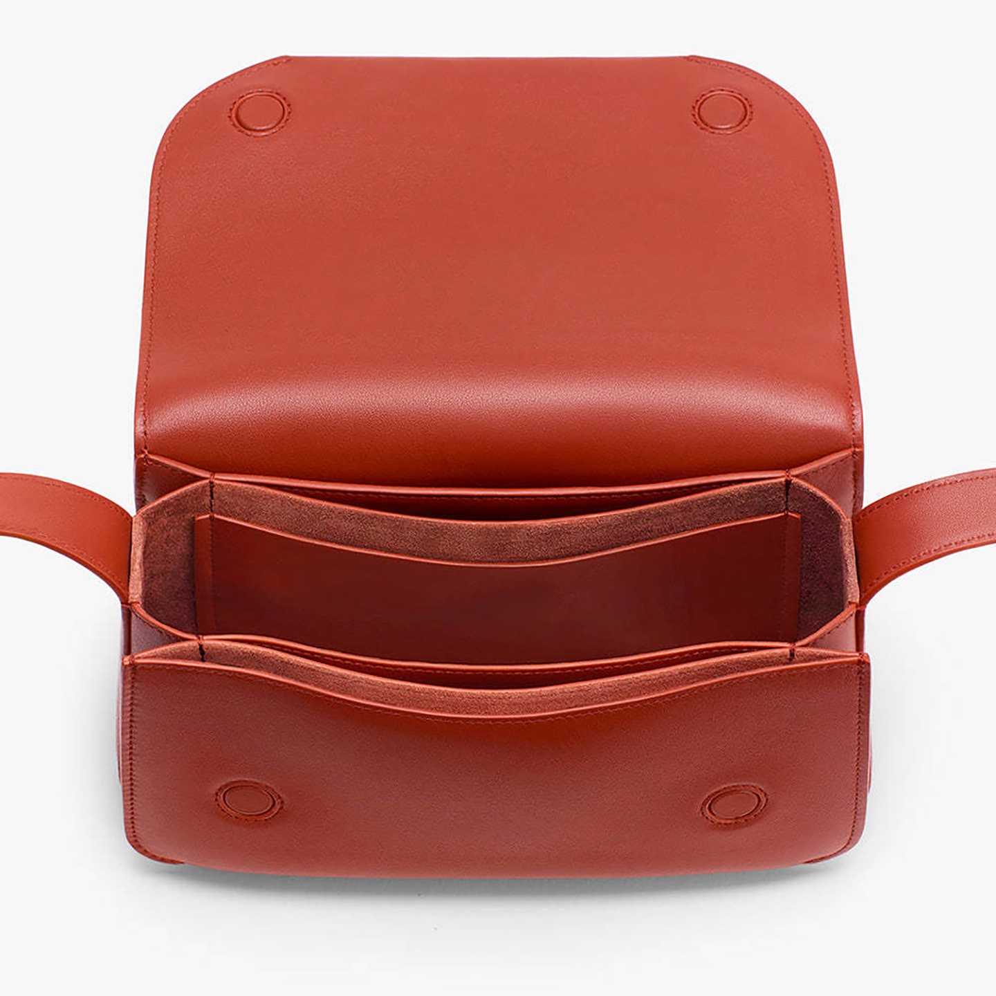 Open interior view of terracotta purse revealing inner zipper pocket and PU lining