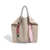 Front view of light gray PU leather bucket bag with playful striped design and vibrant accents