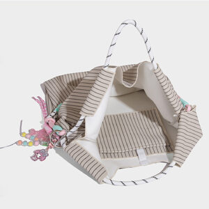 Closeup of light gray summer tote focusing on bead decorations and drawstring