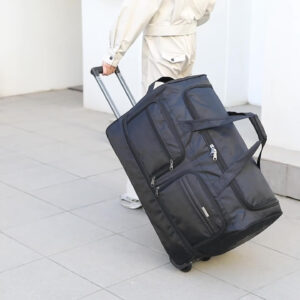 Model pulling black sports bag on wheels in an outdoor setting for travel or gym use