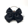 Black satin bow clutch bag with metal ring handle and organza ruffles for evening wear
