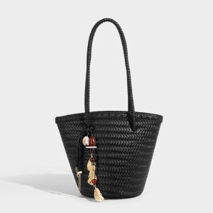 Black bohemian shoulder bag in straw weave with decorative tassel for beach and daily use