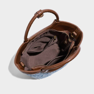 Interior view displaying polyester lining and inner zipper pockets in medium shoulder bag