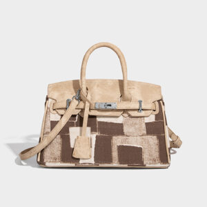 Angled side view highlighting patchwork details on brown large tote bag