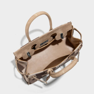 Open interior view displaying polyester lining and slip pocket in denim Birkin bag