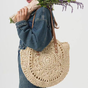 model carry white Large straw beach bag front view with round woven design