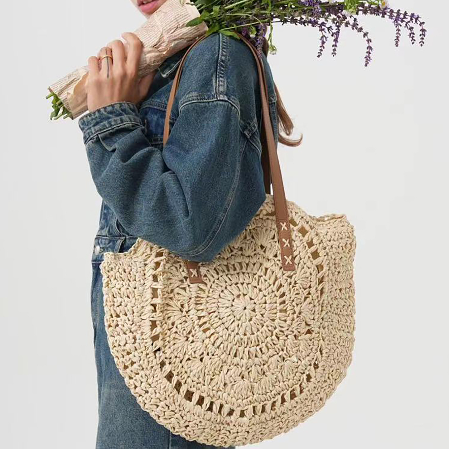 model carry white Large straw beach bag front view with round woven design