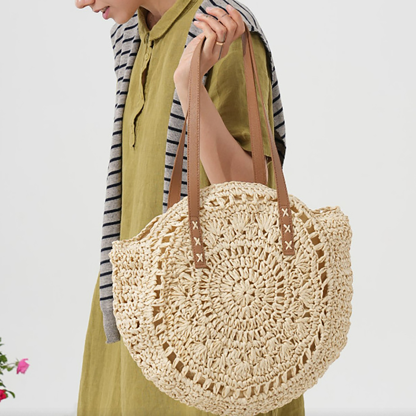model carry white Large straw beach bag front view with round woven design
