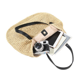 Open view of the woven shoulder bag showing the internal polyester lining, zippered compartment, and slip pockets.