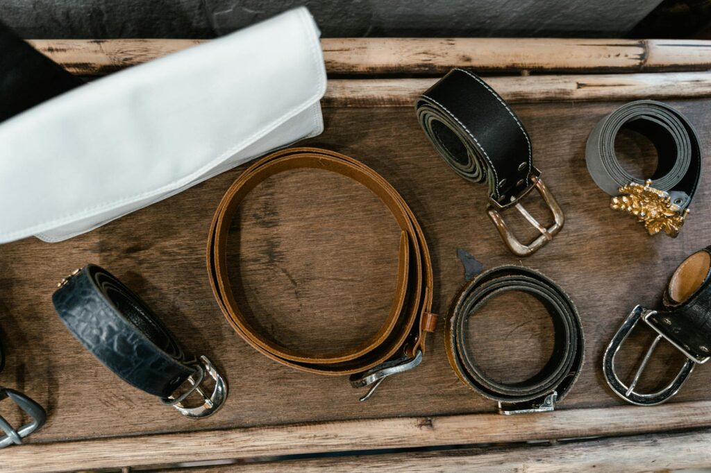 Raw cowhide and finished nubuck leather laid out in a workshop showing the material journey-photo-by-pexels