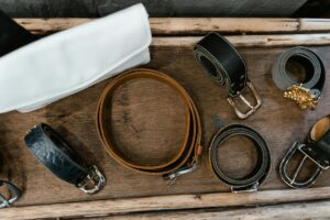 Raw cowhide and finished nubuck leather laid out in a workshop showing the material journey-photo-by-pexels