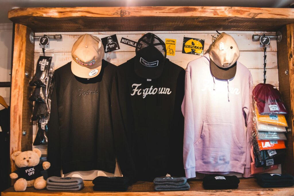tylish-clothes-on-counter-in-shop Photo by Erik Mclean